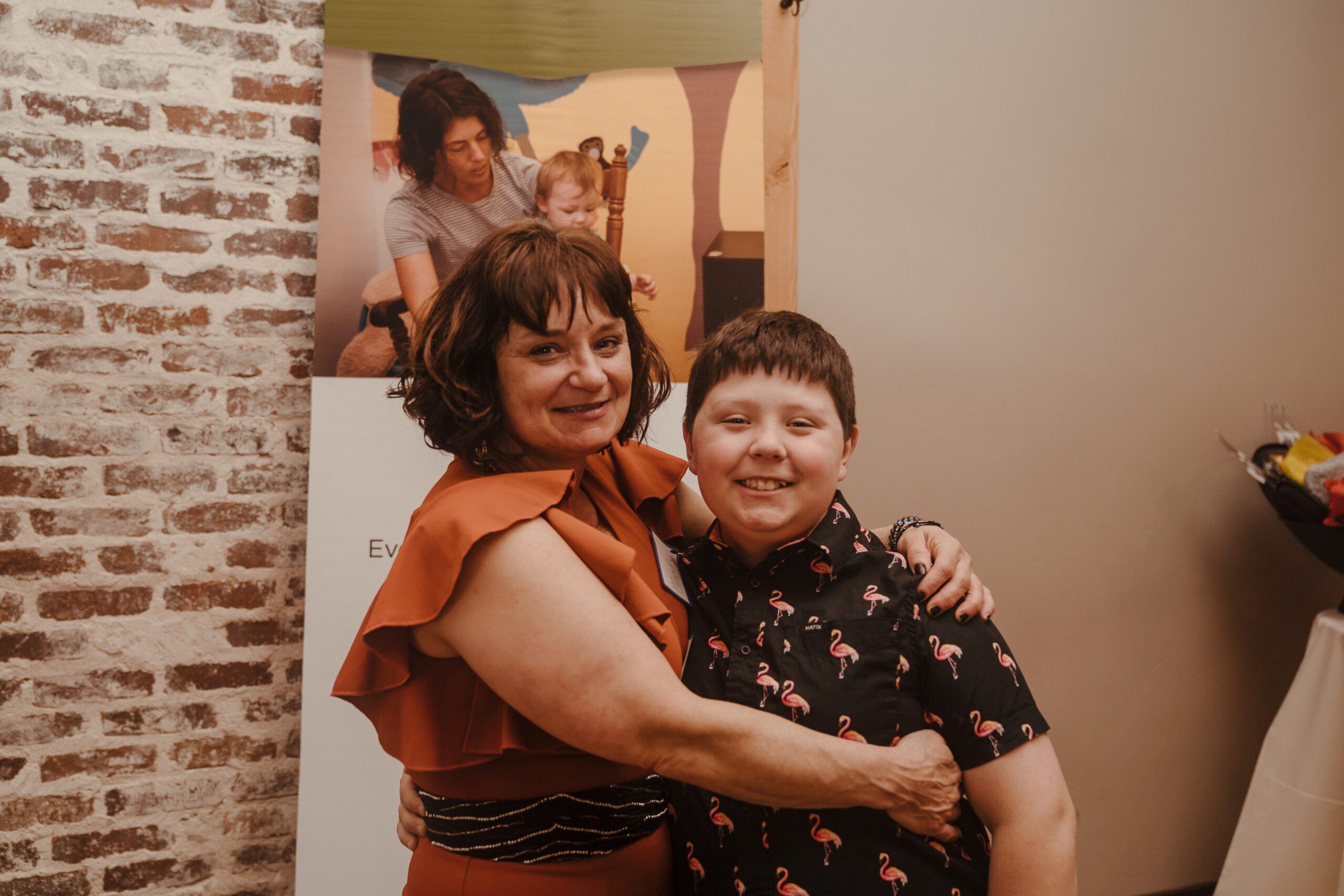 A mother named Mindy and her son, hugging and smiling